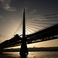 Buy canvas prints of Silhouette of The Metro Bridge at The Golden Horn, Istanbul by Engin Sezer
