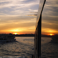 Buy canvas prints of A sunset in Istanbul with the reflections on a boats windows 2 by Engin Sezer