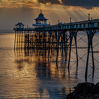Buy canvas prints of Clevedon Pier at sunset on a calm evening by Rory Hailes