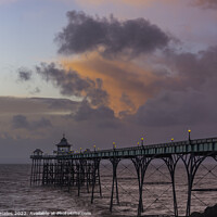 Buy canvas prints of Clevedon Pier at sunset at low tide and choppy sea by Rory Hailes