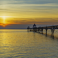 Buy canvas prints of Clevedon Pier with a golden sunset by Rory Hailes