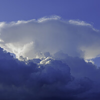 Buy canvas prints of Large cumulus cloud against a blue sky by Rory Hailes