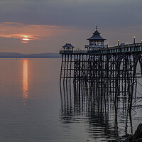 Buy canvas prints of Clevedon Pier at sunset with it legs reflecting in the sea by Rory Hailes