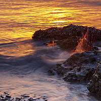 Buy canvas prints of Sunset rocks with a splash by Rory Hailes