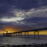 Buy canvas prints of Clevedon Pier at sunset on a cloudy evening by Rory Hailes