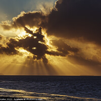 Buy canvas prints of Crepuscular rays breaking through the cloud cover by Rory Hailes