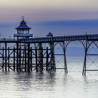Buy canvas prints of Clevedon Pier on a calm evening with a slight bluish hue by Rory Hailes
