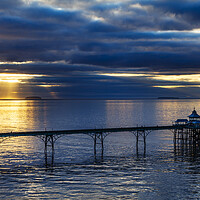 Buy canvas prints of Clevedon Pier on a calm evening at sunset by Rory Hailes