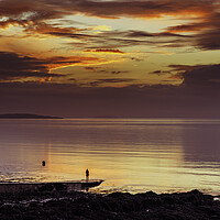 Buy canvas prints of Looking out to sea at a colourful sunset by Rory Hailes