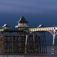Buy canvas prints of Clevedon Pier. at low tide with moody sky by Rory Hailes