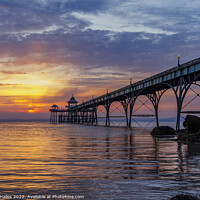 Buy canvas prints of Pier at sunset with golden sunlight by Rory Hailes
