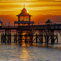 Buy canvas prints of Clevedon at sunset with a streak of sunlight going through the pier head by Rory Hailes