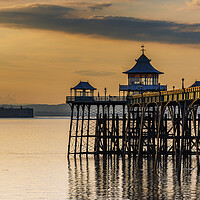 Buy canvas prints of Clevedon Pier at sunset on a calm evening by Rory Hailes