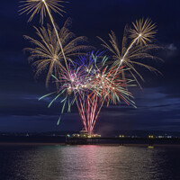 Buy canvas prints of Clevedon Pier Coronation Fireworks on a calm sea by Rory Hailes