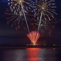 Buy canvas prints of Clevedon Pier Coronation Fireworks on a calm and t by Rory Hailes