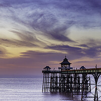 Buy canvas prints of Clevedon Pier at sunset with a colourful sky and cirrus clouds catching the last of the sunlight by Rory Hailes