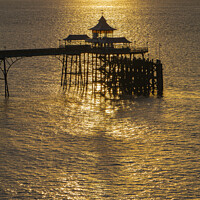 Buy canvas prints of Clevedon Pier at sunset with a calm sea by Rory Hailes