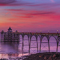 Buy canvas prints of Clevedon Pier at sunset at low tide by Rory Hailes