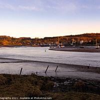 Buy canvas prints of Winter sunset over the River Dee estuary at low tide at Kirkcudbright Harbour by SnapT Photography