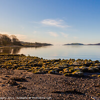 Buy canvas prints of Sunrise on a rocky beach at Kirkcudbright Bay, Dumfries and Galloway, Scotland by SnapT Photography