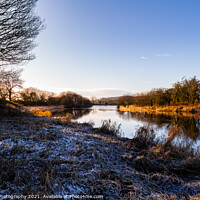Buy canvas prints of A winter scene on the River Dee at Threave castle, with snow and frost by SnapT Photography