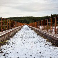 Buy canvas prints of A snow covered old railway viaduct at the Big Water of Fleet and Galloway Forest by SnapT Photography