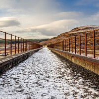Buy canvas prints of A snow covered old railway viaduct at the Big Water of Fleet at the Cairnsmore by SnapT Photography