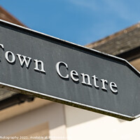 Buy canvas prints of Old vintage town centre arrow shaped sign, pointing the direction by SnapT Photography