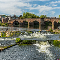 Buy canvas prints of The River Nith flowing over the Caul weir in Dumfries, during summer in Scotland by SnapT Photography