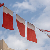 Buy canvas prints of Al-Adaam national flags of Qatar flying in the sky above Doha, Qatar by SnapT Photography