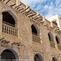 Buy canvas prints of Middle eastern architecture with bamboo wooden poles sticking out of a building by SnapT Photography