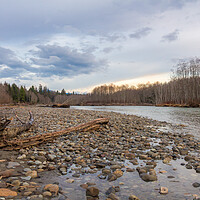 Buy canvas prints of Beautiful spring sunset on a glacial green river in British Columbia, Canada. by SnapT Photography