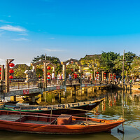Buy canvas prints of Afternoon sun falling on the Cau An Hoi Bridge on the Thun Bon River, in the centre of the beautiful and ancient Hoi An by SnapT Photography