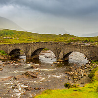 Buy canvas prints of Sligachan bridge by the River Sligachan, on a overcast summers morning on the Isle of Skye, Scotland, with the Cuillin Mountains in the background. by SnapT Photography