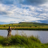 Buy canvas prints of A fisherman fly fishing in the evening on the Blac by SnapT Photography