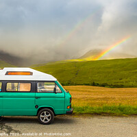Buy canvas prints of An old green camper van in the shadow of misty mountains and a rainbow by SnapT Photography