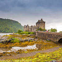 Buy canvas prints of Stormy evening clouds over Eilean Donan Castle in the Scottish Highlands by SnapT Photography
