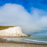 Buy canvas prints of Dramatic white cliffs, blue sky and shingle beach  by SnapT Photography