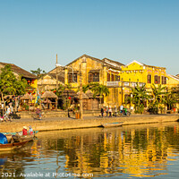 Buy canvas prints of The ancient town of Hoi An in Vietnam, reflecting on the water by SnapT Photography