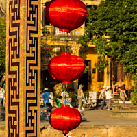Buy canvas prints of Three red vietnamese or chinese lanterns hanging in Hoi An, Vietnam by SnapT Photography