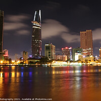 Buy canvas prints of Long exposure and reflection of the Ho Chi Minh City skyline at night by SnapT Photography
