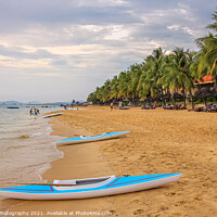 Buy canvas prints of Kayaks on Ba Keo Beach in the evening sun, next to by SnapT Photography