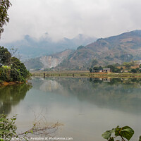 Buy canvas prints of A mountain reflection on a lake in a rice paddy, Sapa, Vietnam by SnapT Photography