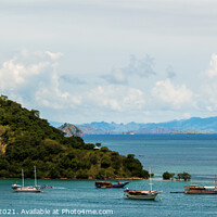 Buy canvas prints of Palua Pungua Besar island and boats near Labuan Bajo, Flores, Indonesia by SnapT Photography