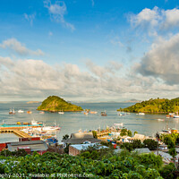 Buy canvas prints of A view over the town of Labuan Bajo and harbour in the morning, Indonesia by SnapT Photography