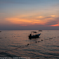 Buy canvas prints of A speed boat at Melina Beach, Tiomen Island, at sunset, Malaysia by SnapT Photography