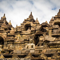 Buy canvas prints of The upper section of the Borobudur Buddhist temple and clouds, Indonesia by SnapT Photography