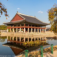 Buy canvas prints of A Korean pavilion reflecting on a lake at Gyeongbokgung Palace on an autumn day by SnapT Photography