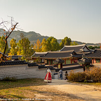 Buy canvas prints of Women in hanboks walking at Gyeongbokgung Palace, Seoul, South Korea by SnapT Photography