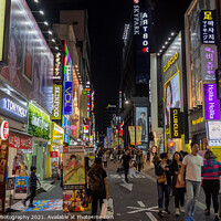 Buy canvas prints of Myeongdong Shopping District at night in Seoul, South Korea by SnapT Photography